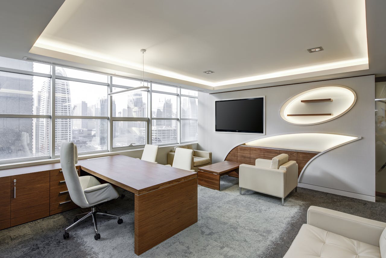 brand-02 Sleek office space featuring contemporary furniture and city skyline views, ideal for professionals.