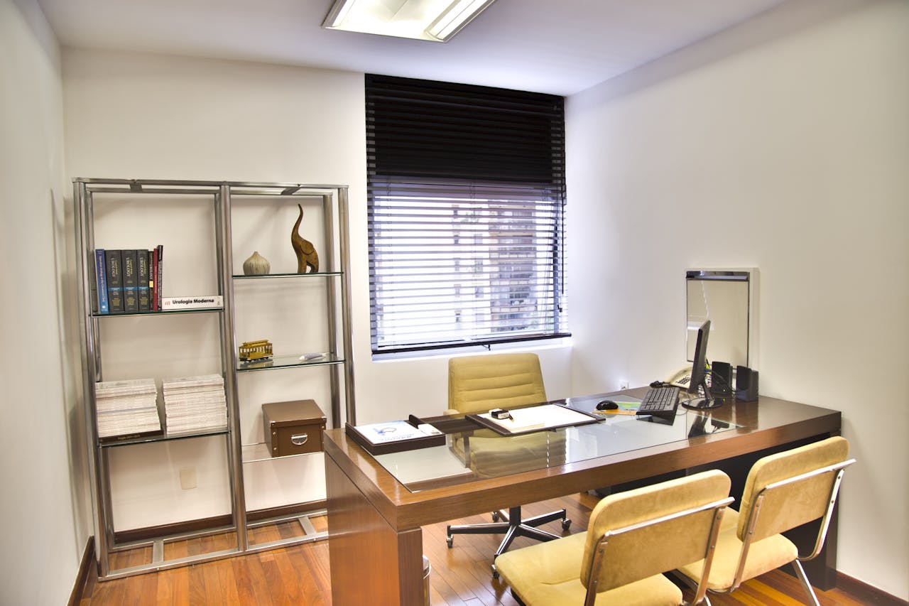 creative Sleek and contemporary office space featuring a wooden desk, chairs, and organized shelves.